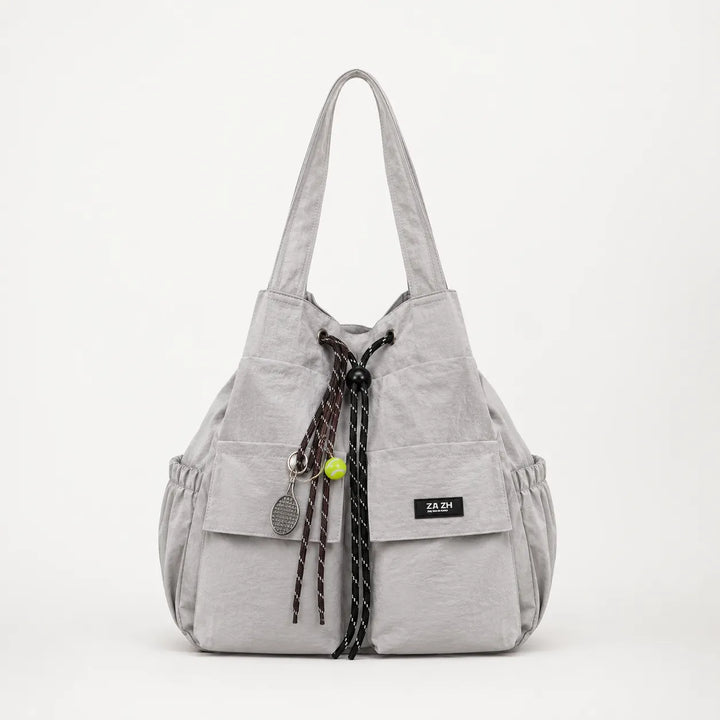 Carryall – Convertible Drawstring Canvas Tote Backpack with Cargo Pockets